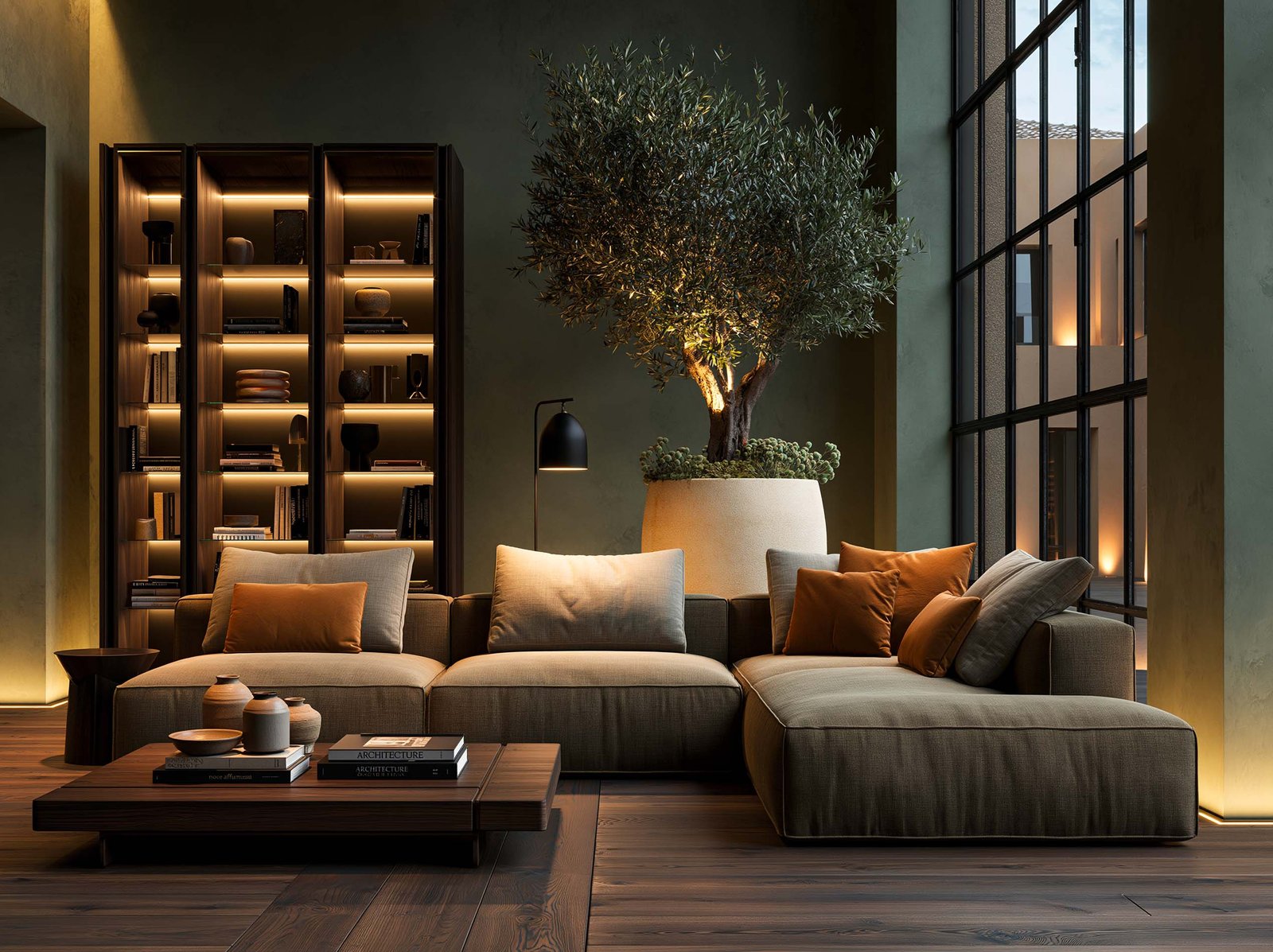 Lounge collaboratif corporate sur la Côte d’Azur — banquettes en cuir, bibliothèque rétroéclairée et présence végétale architectural