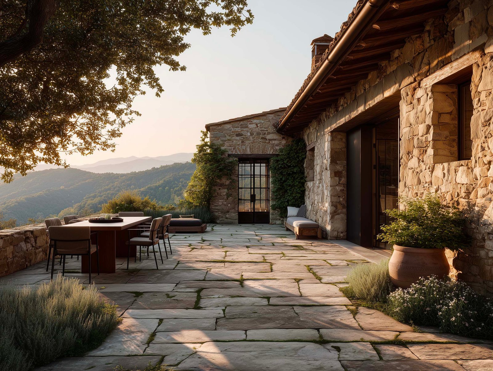 Terrazza di cascina piemontese ristrutturata con fioriera Lignum, Salvia officinalis e Olea europaea, partizione botanica e loggia, colline vitate sullo sfondo, Paracelsus Gardens™